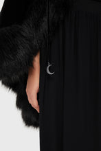 Load image into Gallery viewer, Black faux fur-trimmed coat with a silver moon pendant on a white background