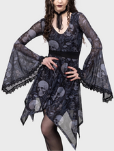 Load image into Gallery viewer, Woman wearing a black and white dress with skull and flower pattern on a white background