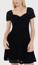Load image into Gallery viewer, Model wearing a black lace dress on a white background