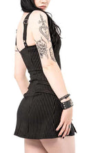 Load image into Gallery viewer, Model wearing a black and white pinstripe dress with zippers on a white background