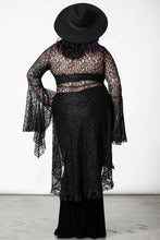 Load image into Gallery viewer, Model wearing a black lace top with a plain background