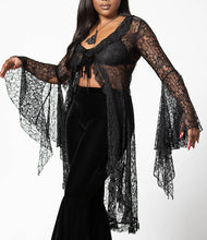 Load image into Gallery viewer, Model wearing a black lace top with a plain background
