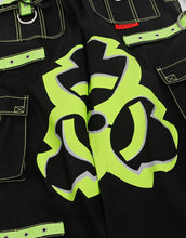Load image into Gallery viewer, Black wide-leg cargo pants with lime green contrast stitching, decorative straps, and a large lime green biohazard graphic on the legs.