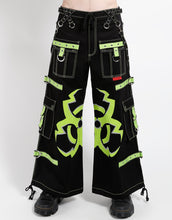 Load image into Gallery viewer, Black wide-leg cargo pants with lime green contrast stitching, decorative straps, and a large lime green biohazard graphic on the legs.