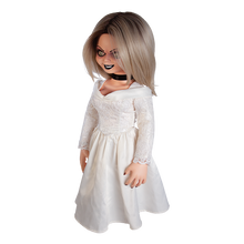 Load image into Gallery viewer, Doll is clothed with a white long sleeve wedding dress and black choker accessory. Has tattoo on right breast of a red heart with a dagger stabbed in it and the text "chucky" above the heart.