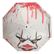 Load image into Gallery viewer, White umbrella with Pennywise IT clown face screen printed on it. Color changing art when wet.
