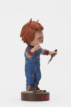 Load image into Gallery viewer, side of Head knocker bobble head of Chucky from Child's Play 2. Chucky has his right hand up, mouth open as if he is yelling, and in his left hand is clutching a knife. Chucky stands on a small round platform that reads "CHUCKY" in red letters on the front.