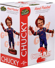 Load image into Gallery viewer, box of Head knocker bobble head of Chucky from Child's Play 2. Chucky has his right hand up, mouth open as if he is yelling, and in his left hand is clutching a knife. Chucky stands on a small round platform that reads "CHUCKY" in red letters on the front.