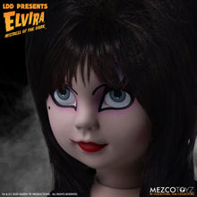 Load image into Gallery viewer, up close view of Elvira Living Dead Doll, with iconic black dress and batty, teased hair, and comes with a dagger that she can store in her waist belt. Stands 10” tall and features 5 points of articulation. Packaged in window box for display.