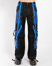Load image into Gallery viewer, front of Black and blue studded pants zip off into shorts and feature removable chains, adjustable ankles, zippers, D-rings, and deep pockets.