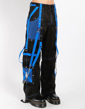 Load image into Gallery viewer, side of Black and blue studded pants zip off into shorts and feature removable chains, adjustable ankles, zippers, D-rings, and deep pockets.