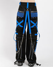 Load image into Gallery viewer, back of Black and blue studded pants zip off into shorts and feature removable chains, adjustable ankles, zippers, D-rings, and deep pockets.