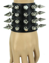 Load image into Gallery viewer, Black leather bracelet with four rows of 1" spikes, four rows of 1/2" spikes.