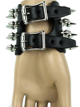 Load image into Gallery viewer, Black leather bracelet with four rows of 1" spikes, four rows of 1/2" spikes.