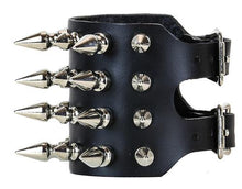 Load image into Gallery viewer, Black leather bracelet with four rows of 1" spikes, four rows of 1/2" spikes.
