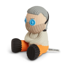 Load image into Gallery viewer, side of figure on display