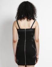 Load image into Gallery viewer, back of Short black dress with adjustable straps and bondage belt details all over the front and back of the dress.
