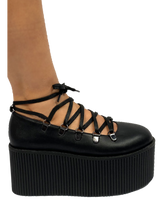 Load image into Gallery viewer, Black vegan leather upper, silver chrome hardware, black molded bottom. Top of Mary Jane laces up through D rings, and then ties around the ankle.
