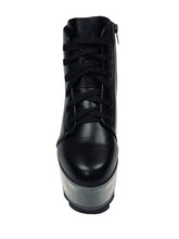 Load image into Gallery viewer, front view of black vegan leather platform shoe with clear plastic platform. Shoe looks like a sneaker, but is super tall! Clear plastic bottom has a Velcro foot bed opening, to insert toys, candy or fun stuff into the clear bottom of the shoe.