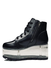 Load image into Gallery viewer, inner view of black vegan leather platform shoe with clear plastic platform. Shoe looks like a sneaker, but is super tall! Clear plastic bottom has a Velcro foot bed opening, to insert toys, candy or fun stuff into the clear bottom of the shoe.