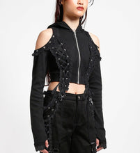 Load image into Gallery viewer, side of Black hoodie with gothic Lolita details. Hoodie has long sleeves that have thumb holes and black lace around the hands. Shoulders are open, and have edges of black on black lace details, as well as silver rivet details around the edge. Front of hoodie zips up, and has black on black lacey lace-up panels on right and left of zipper. Hoodie has black hood.