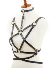 Load image into Gallery viewer, mannequin displaying black leather inverted pentagram shaped eight strap body harness with attached choker and multiple silver o rings
