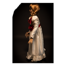 Load image into Gallery viewer, doll wearing white long sleeve dress with red carnation accessory belt. doll is holding parchment paper that reads "miss me?"