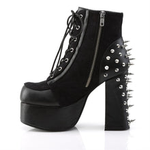 Load image into Gallery viewer, left side view of black vegan leather with suede panels 4.5 inch heel ankle boot with three O ring designs with spike in middle on each side of boot, tree spikes and s tuds on the back and 7 eyelet lace-up front with full left side zipper