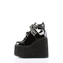 Load image into Gallery viewer, inner side view of black vinyl 5.5" wedge platform Mary Jane style Lace-up front Wrap around style studded adjustable strap around ankle