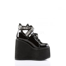 Load image into Gallery viewer, outer side view of black vinyl 5.5" wedge platform Mary Jane style Lace-up front Wrap around style studded adjustable strap around ankle