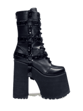 Load image into Gallery viewer, Black vegan leather super tall 6" heel boot with black vegan patent leather O ring straps on the side, black enamel hardware and EVA bottom. Boot has full lace-up front and full back zipper.