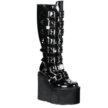 Load image into Gallery viewer, outer side view of black vinyl 5 1/2" wedge platform Goth punk gogo knee high boot Adjustable straps from top to bottom of boot, with metal plates up the front with full back zipper