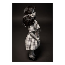 Load image into Gallery viewer, talky tina replica doll with pig tails, wearing a plaid dress with bow around the waist, and black flats with white socks