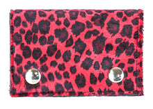 Load image into Gallery viewer, Pink wallet with black leopard print and silver buttons on a white background
