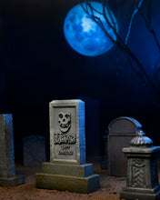 Load image into Gallery viewer, Graveyard scene with a tombstone featuring a skull design under a moonlit sky.
