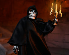 Load image into Gallery viewer, Figure in a black hooded cloak with skeleton face holding a candelabrum against a dark background
