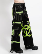Load image into Gallery viewer, Black wide-leg cargo pants with lime green contrast stitching, decorative straps, and a large lime green biohazard graphic on the legs.
