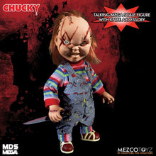 Load image into Gallery viewer, Chucky doll with knife accessory on a red and black background, featuring Mezco Toyz branding.
