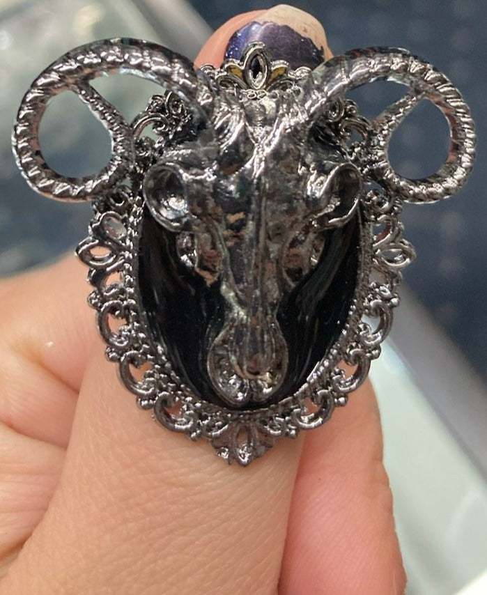 Zinc alloy silver colored large goat ram head skull ring.