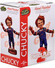 Load image into Gallery viewer, box of Head knocker bobble head of Chucky from Child&#39;s Play 2. Chucky has his right hand up, mouth open as if he is yelling, and in his left hand is clutching a knife. Chucky stands on a small round platform that reads &quot;CHUCKY&quot; in red letters on the front.
