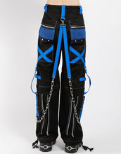 Load image into Gallery viewer, back of Black and blue studded pants zip off into shorts and feature removable chains, adjustable ankles, zippers, D-rings, and deep pockets.
