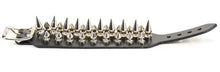 Load image into Gallery viewer, Black leather bracelet with three rows of silver spikes. Top and bottom row consist of 1/2&quot; silver spikes. Center row consists of 1&quot; silver spikes.
