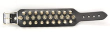 Load image into Gallery viewer, Black leather bracelet with three rows of silver spikes. Top and bottom row consist of 1/2&quot; silver spikes. Center row consists of 1&quot; silver spikes.
