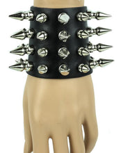Load image into Gallery viewer, Black leather bracelet with four rows of 1&quot; spikes, four rows of 1/2&quot; spikes.
