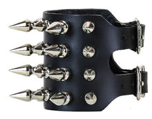 Load image into Gallery viewer, Black leather bracelet with four rows of 1&quot; spikes, four rows of 1/2&quot; spikes.
