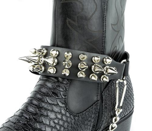 boot displaying black leather boot strap with three rows of half inch and one inch silver spikes and silver hanging chain