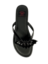 Load image into Gallery viewer, top of Black flat sandal with vegan leather patent bat on top.  Vegan leather with black rubber outsole.
