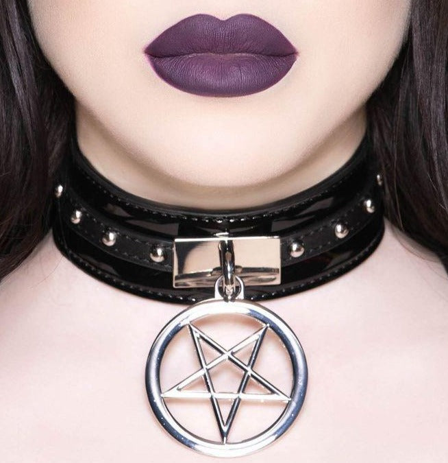 Black catnip choker features a high-quality faux leather strap, grungy studs and hanging pentagram hardware - complete with an adjustable fastening for the perfect fit.