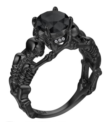 Black skeleton band and large black cubic zirconia on top center.