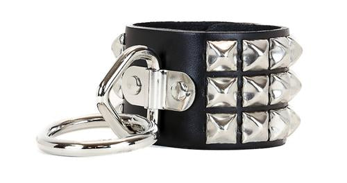 Black leather bracelet with three rows of silver pyramid studs. One side of the bracelet has a D ring with large O ring attached.